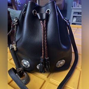 Vintage Dooney and Bourke black leather drawstring bag.